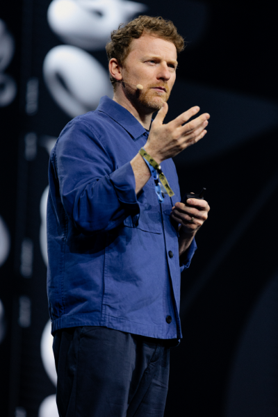 Tom speaking on a stage at ADC Germany Festival in 2025.